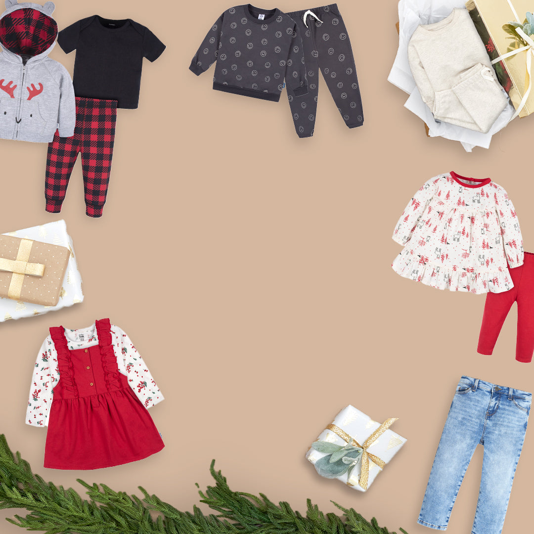 A delightful assortment of baby clothes and gifts, perfect for the holiday season, set against a rich brown backdrop.