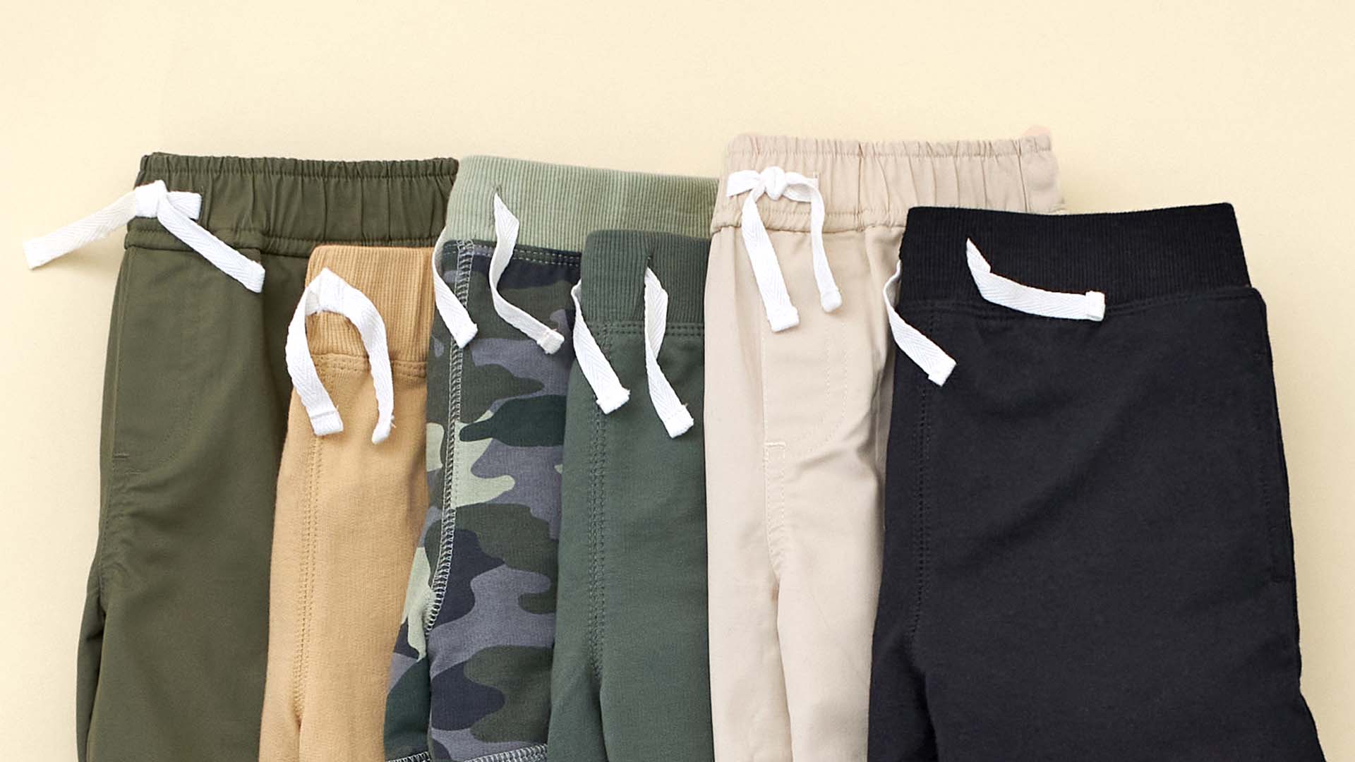 A collection of toddler boy's joggers in various colors, designed to be comfy and cozy.