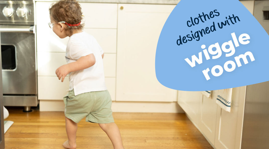 Child in a kitchen wearing clothes with 'wiggle room' text overlay