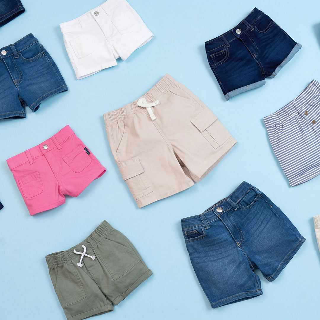 Collection of various shorts on a light blue background