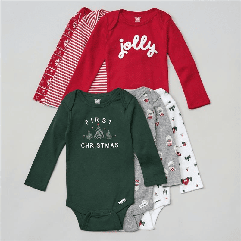 Collection of baby onesies with festive designs on a gray background