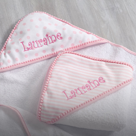Pink baby girl embroidery with the name Lauraine on it.