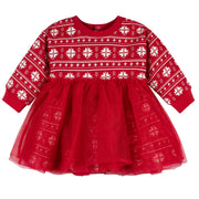 Red dress with white snowflake pattern on a white background