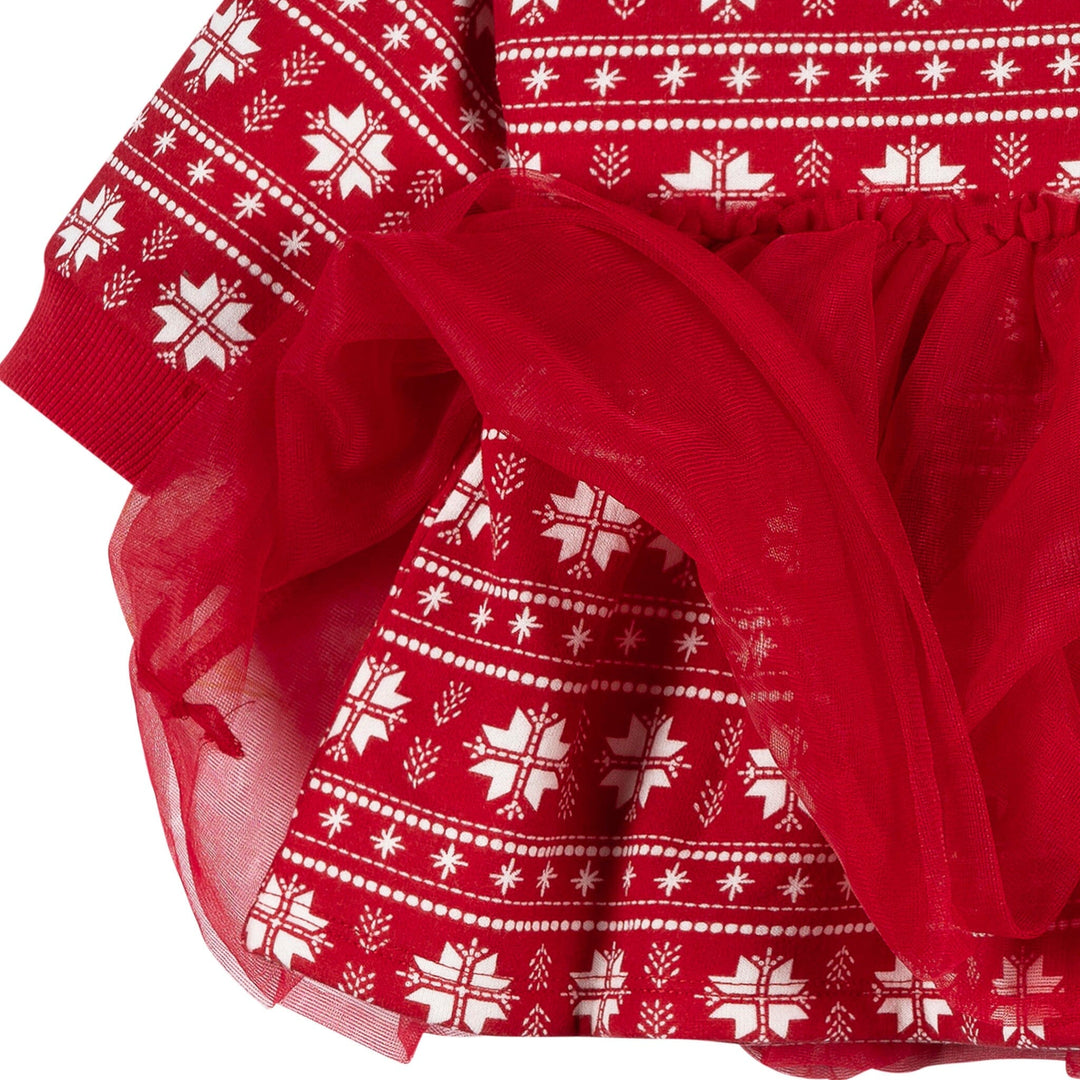 Red fabric with white pattern, possibly a scarf or dress material