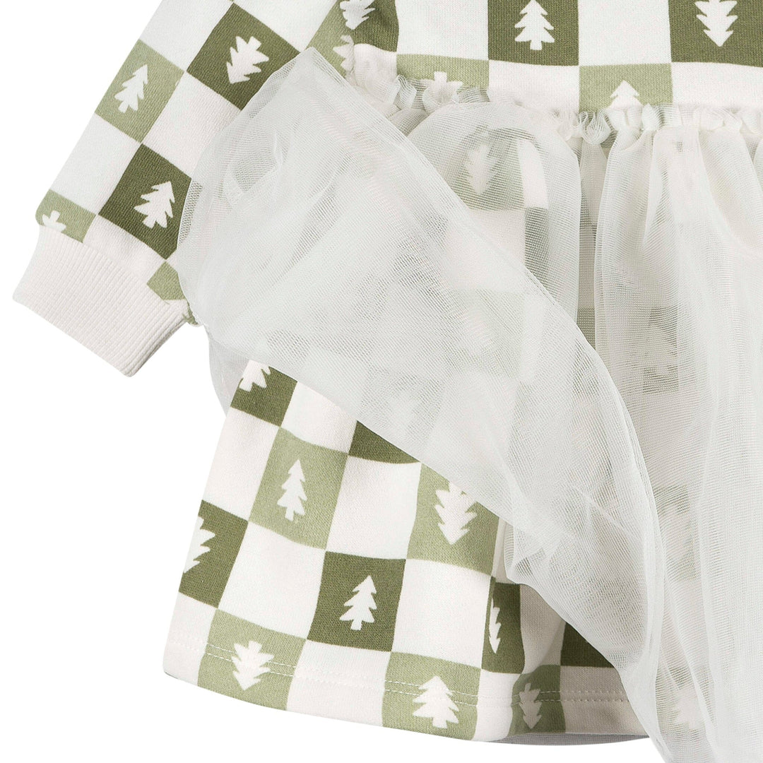 Checkered fabric with tree pattern and sheer overlay on a white background