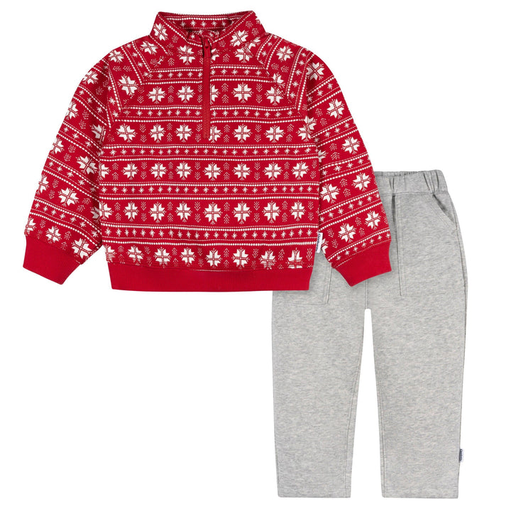 Red sweater with white patterns and gray pants on a white background