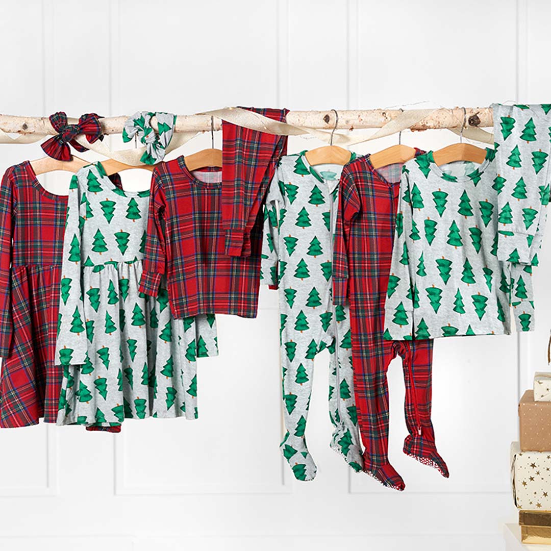  Assorted holiday attire gracefully suspended on a clothes rack, ready for the Christmas season.
