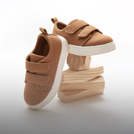 Brown shoes on wooden blocks.
