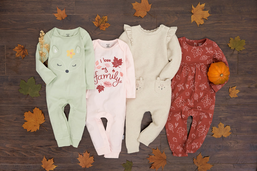 Cute fall girl rompers paired with pumpkins for the perfect autumn photo op! 
