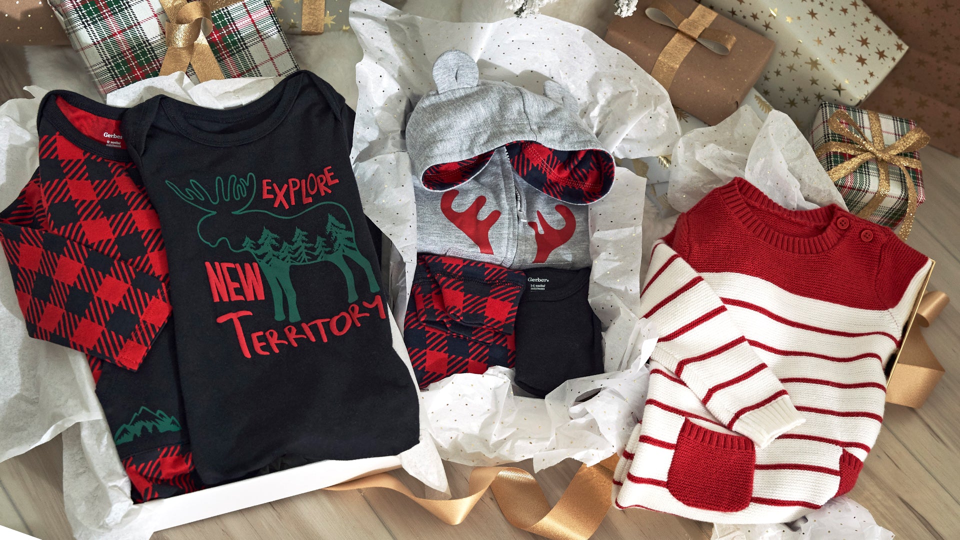 Get your little ones ready for the holidays with this gift set of toddler and baby clothing, including a red and black plaid shirt, a red and white striped shirt, and a red and white striped sweater.