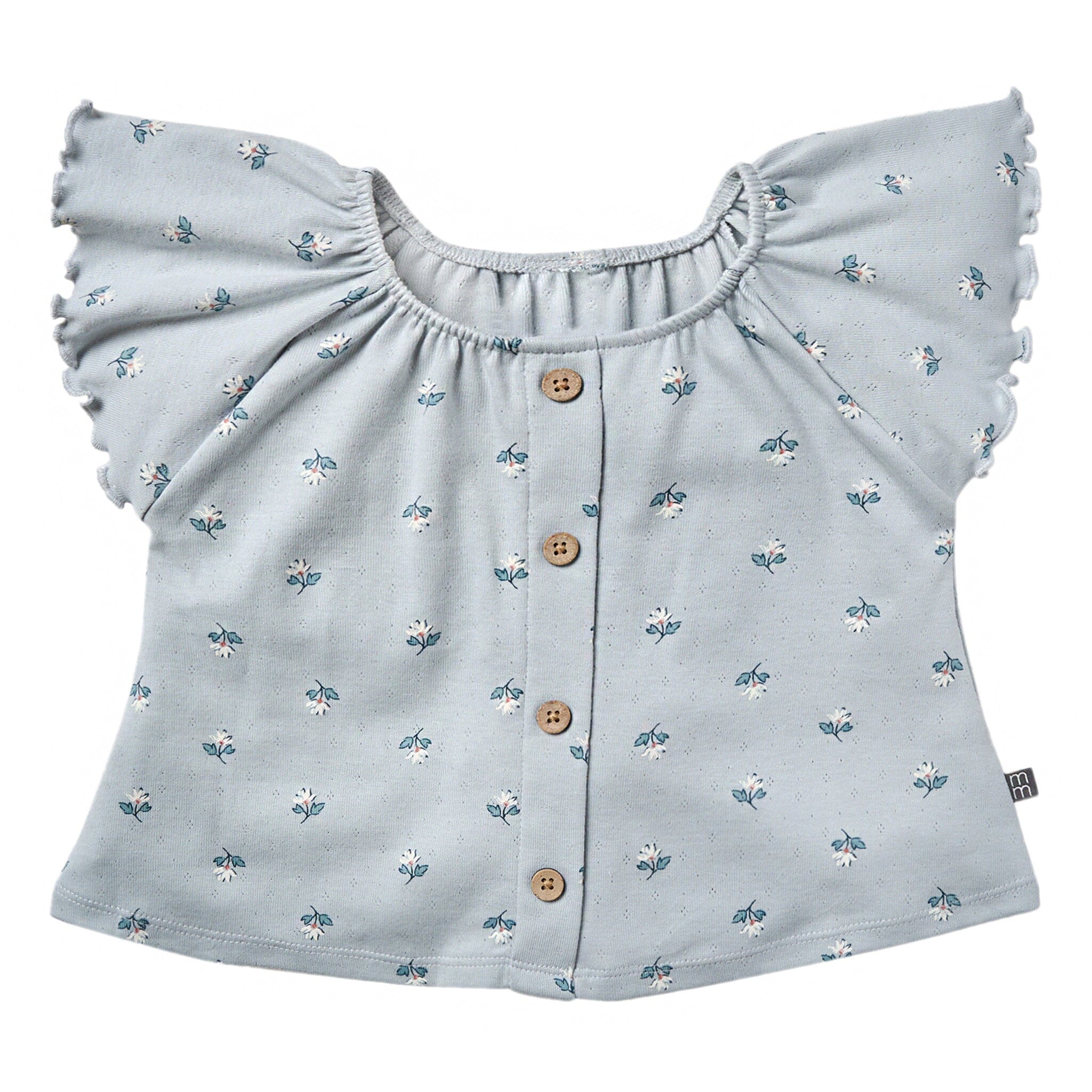 Light blue blouse with floral pattern and ruffled shoulders on a white background