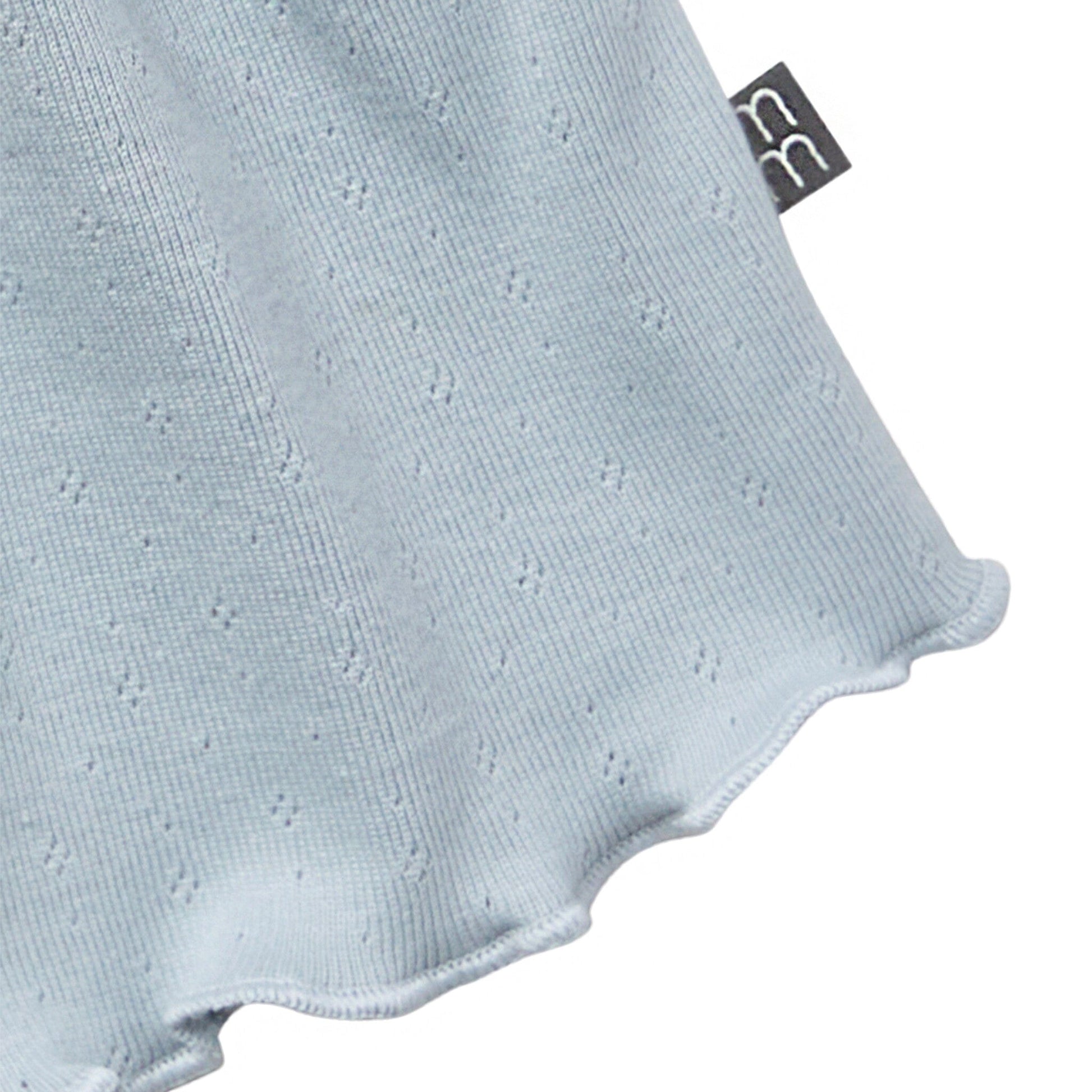 Light blue baby romper with a visible brand tag on a white background