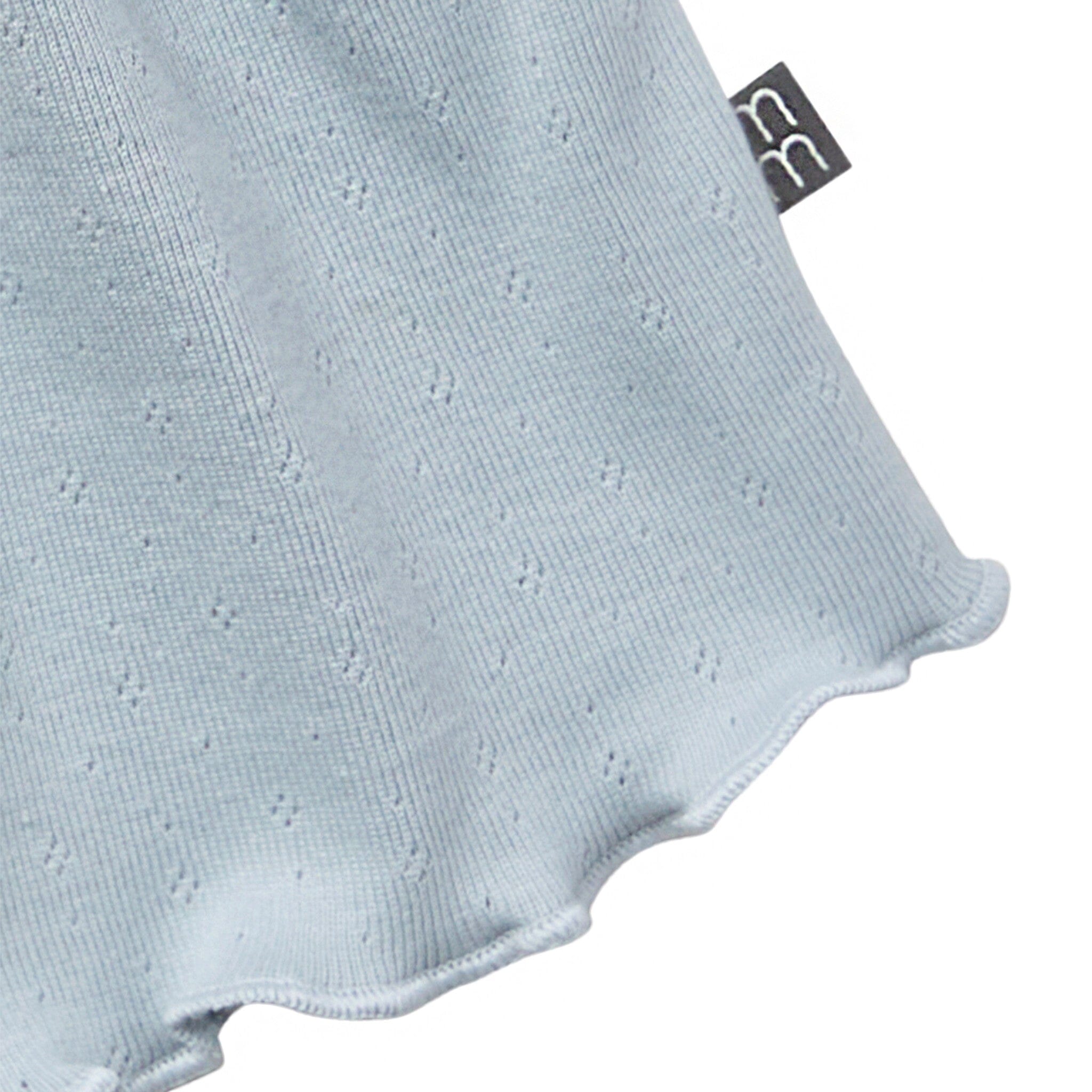 Light blue baby romper with a visible brand tag on a white background