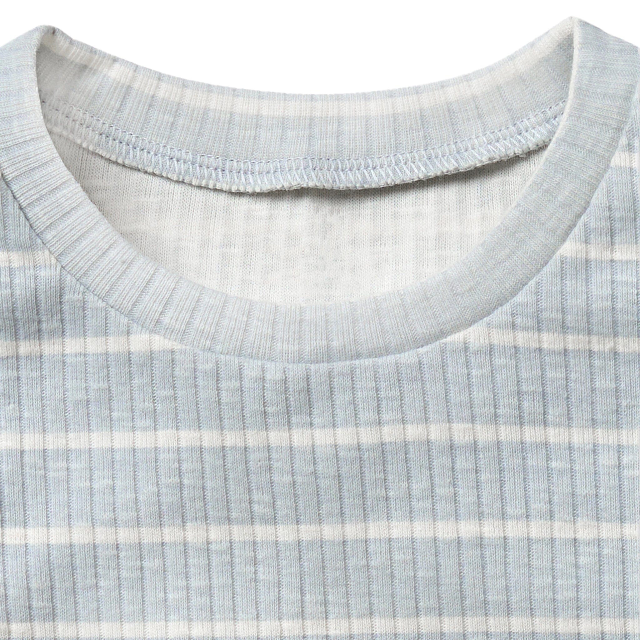Close-up of a ribbed knit fabric with a collar detail