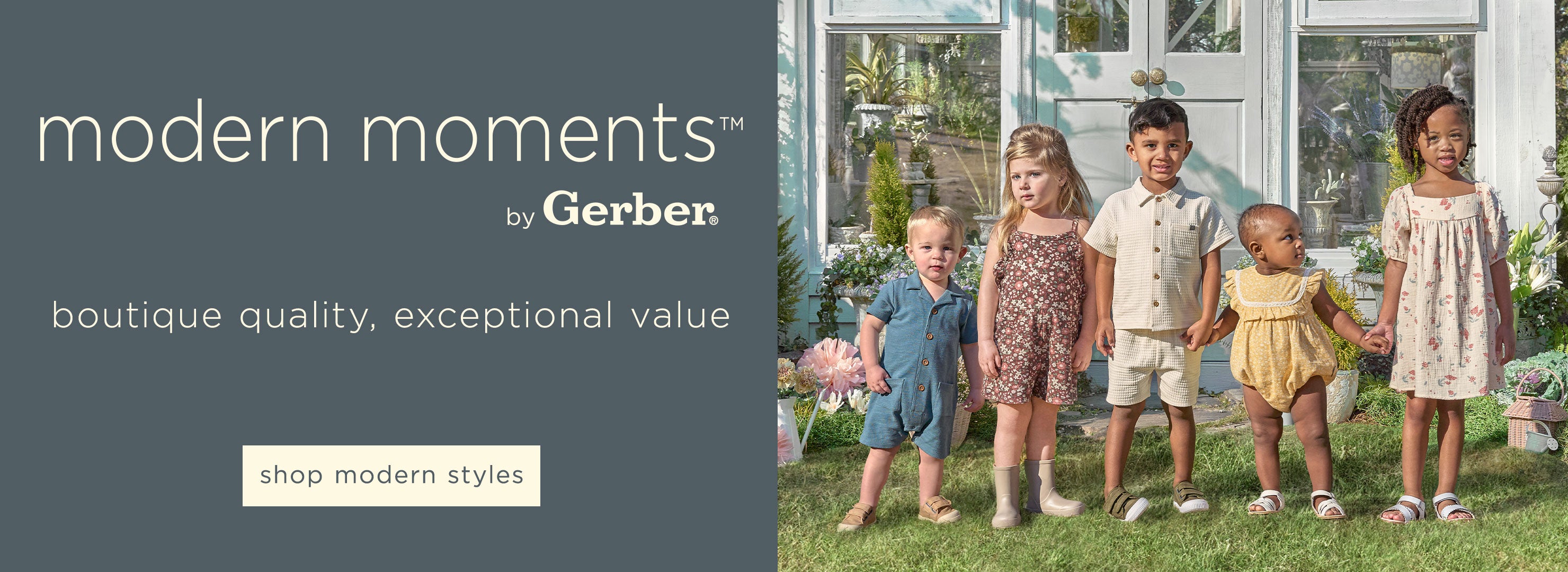 A group of stylishly dressed toddlers standing hand in hand in a sunny garden. Click here to shop Modern Moments by Gerber.